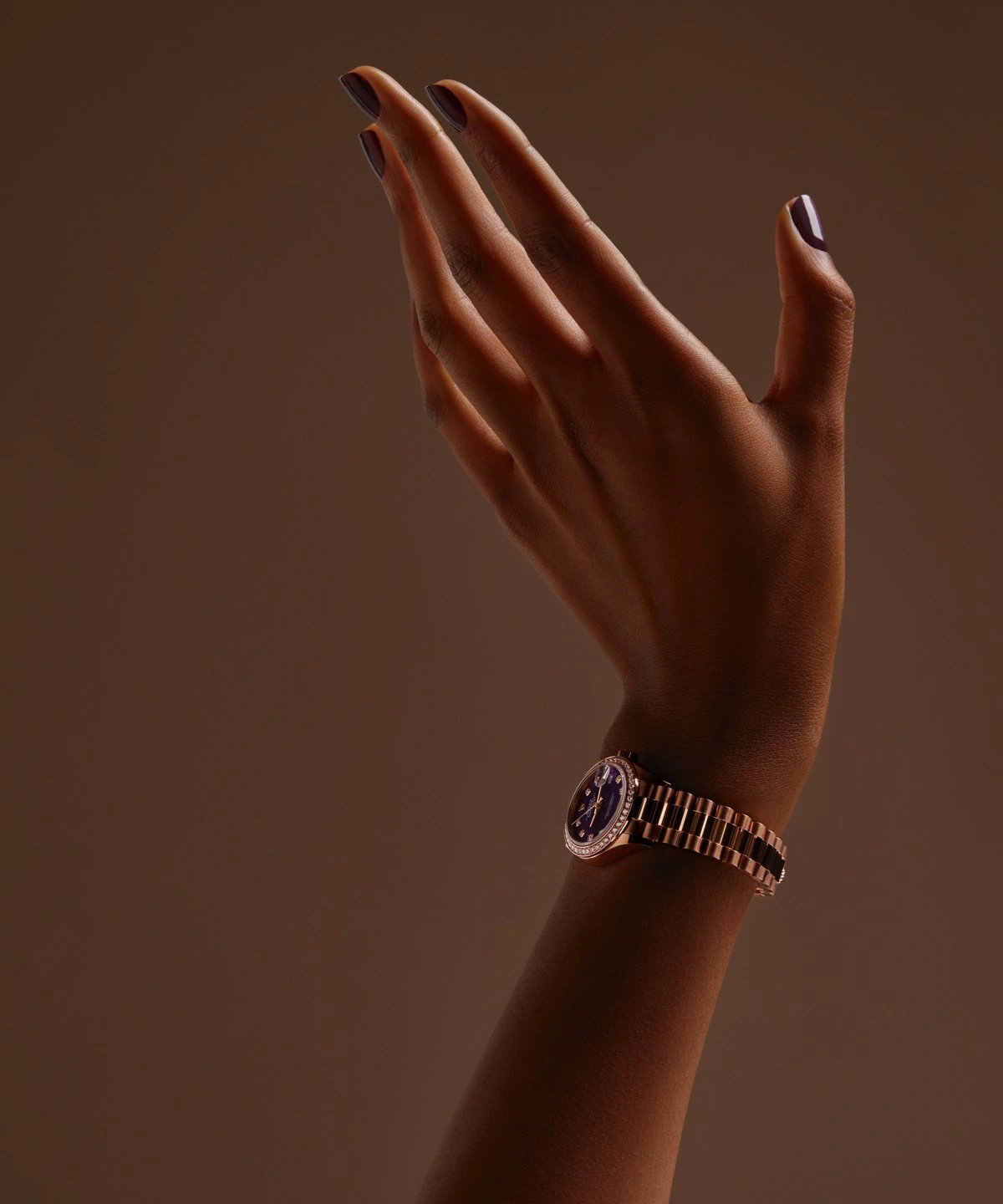 Close-up of the watch on bracelet at sunrise