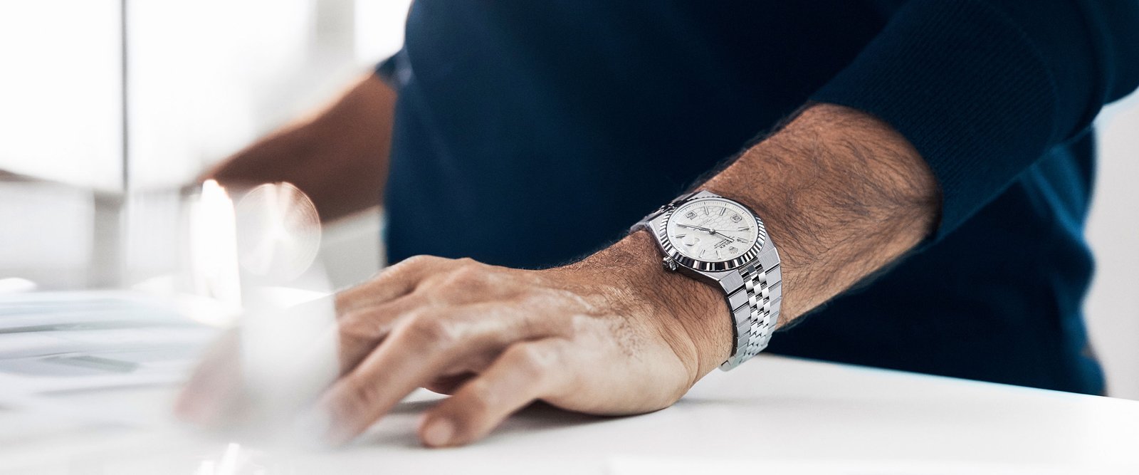 Ambassador with wrist watch